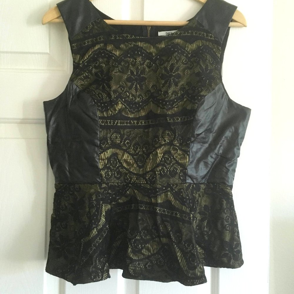 Peplum top with faux leather accents